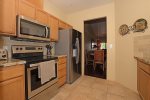 The adjoining kitchen is spacious and fully-equipped with brand new appliances, dishes and cookware